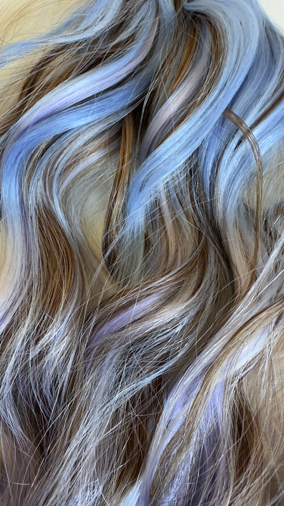 Close-up of wavy hair with blue and brown tones.