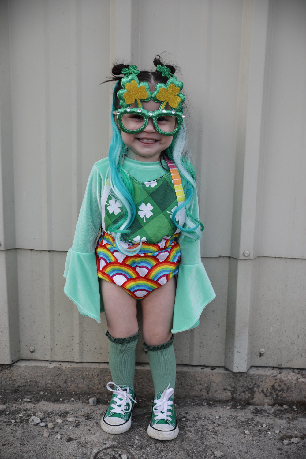 Little girl with green hair extensions clip-in shamrock mint and bright neon green hair.