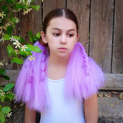 Young girl with festival style ponytail braided extensions in light purple