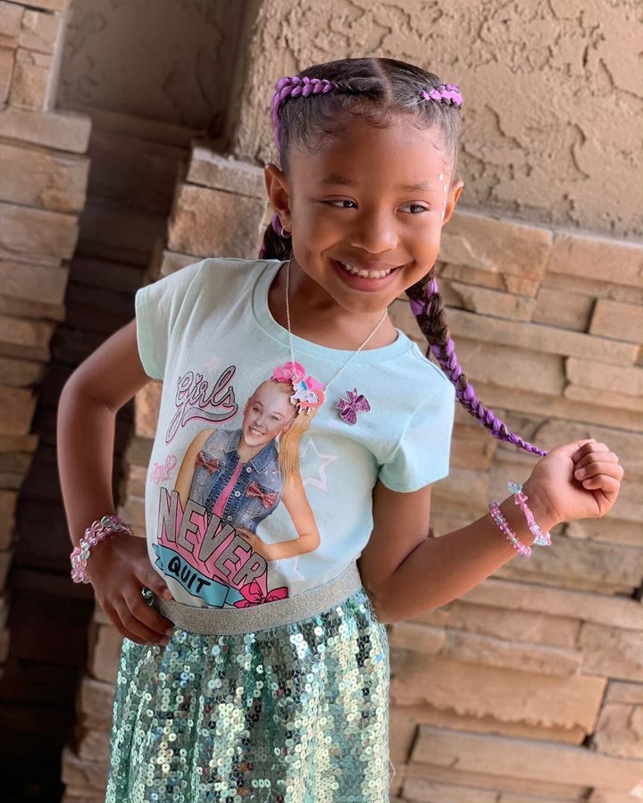 Magic Braiding Hair jumbo braid 24” lifestyle shot with young, beautiful model in two purple and lavender French braids. 