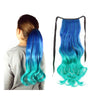 A young model wears a teal blue, green and aqua ombre hair extension ponytail