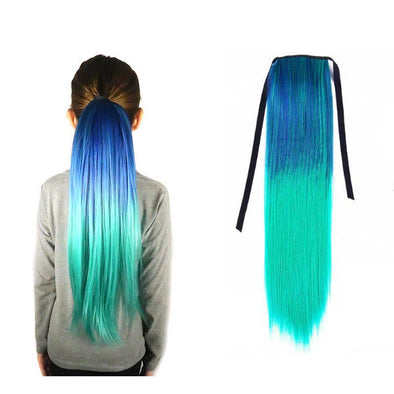 A young model wears a blue and aqua ponytail hair extension against a white background