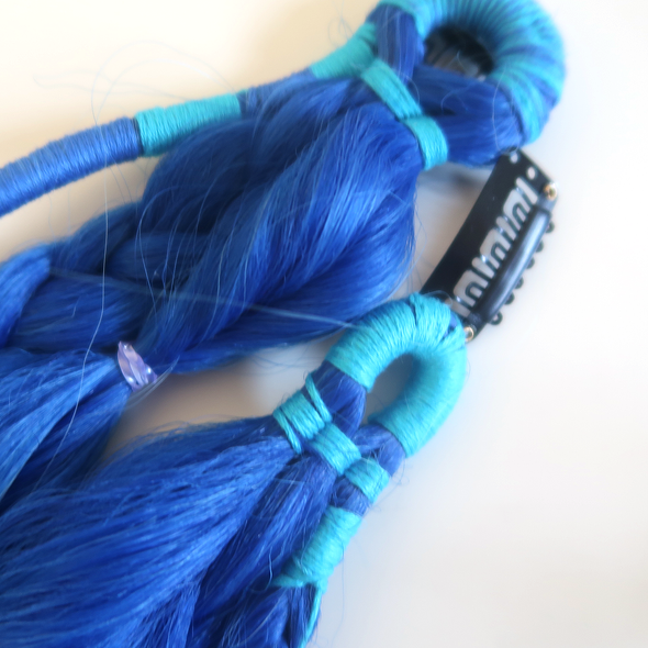 Detail close-up of royal blue and light blue boho braids