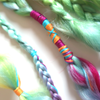 Detail of rainbow boho braids clip-in extensions