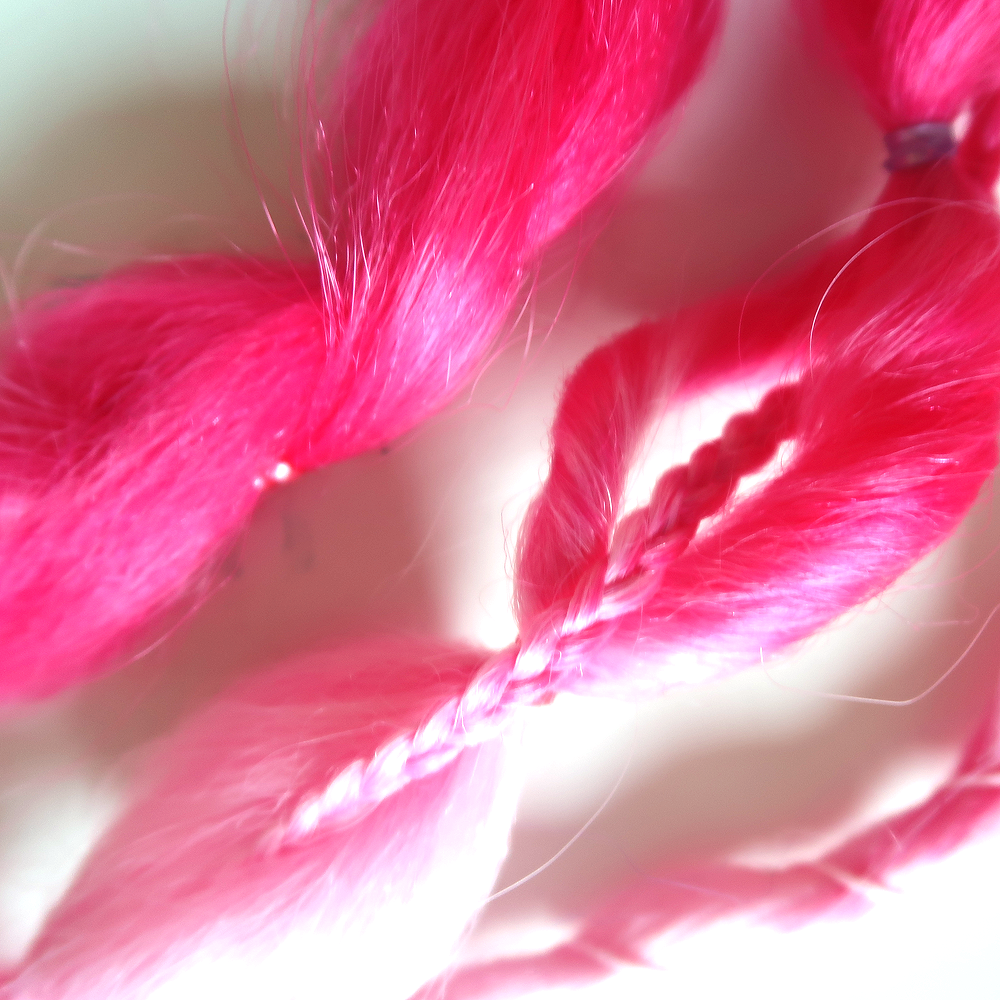 Close-up detail of braided clip-in extensions