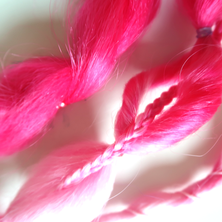 Close-up detail of braided clip-in extensions